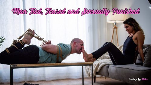Kali dominating her tied boyfriend, using foot play while he remains gagged and restrained on the table.