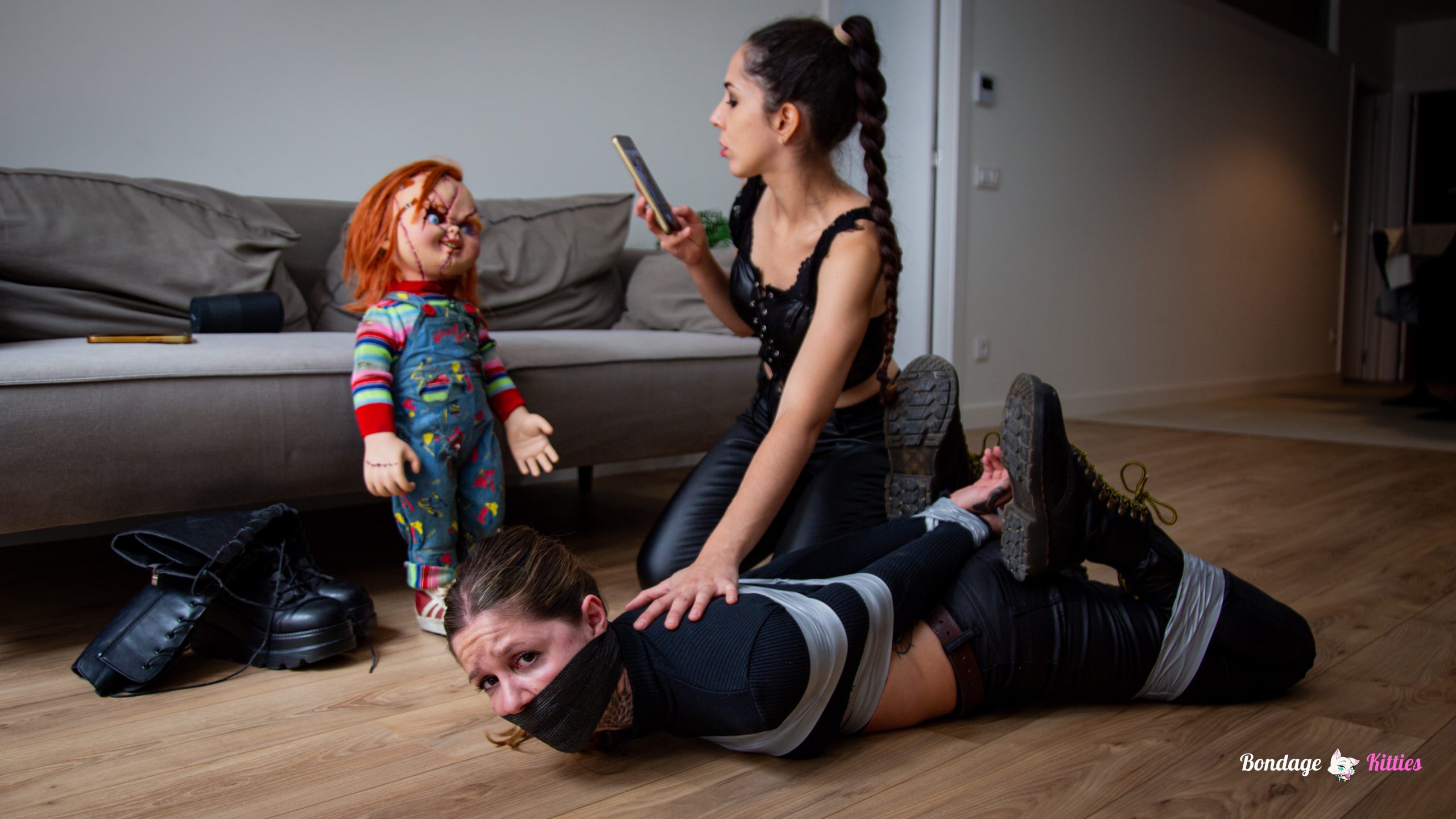 Bound roommate Aly in tape gag and floor bondage controlled by Lyla